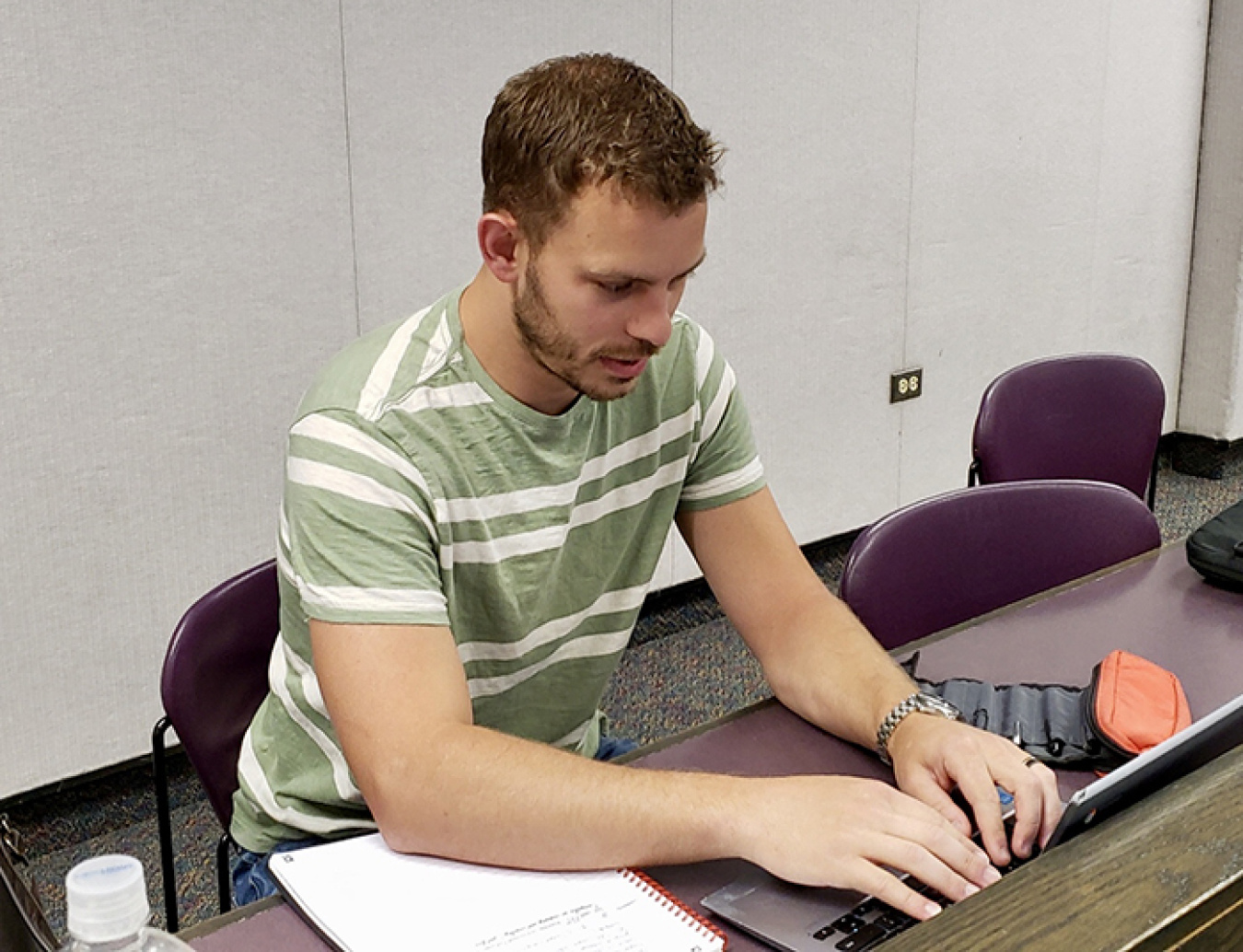 Daniel Walker works on an assignment at Idaho State University. While a Fluor Idaho intern, Walker responded to the information technology needs of computer users and even developed an app.