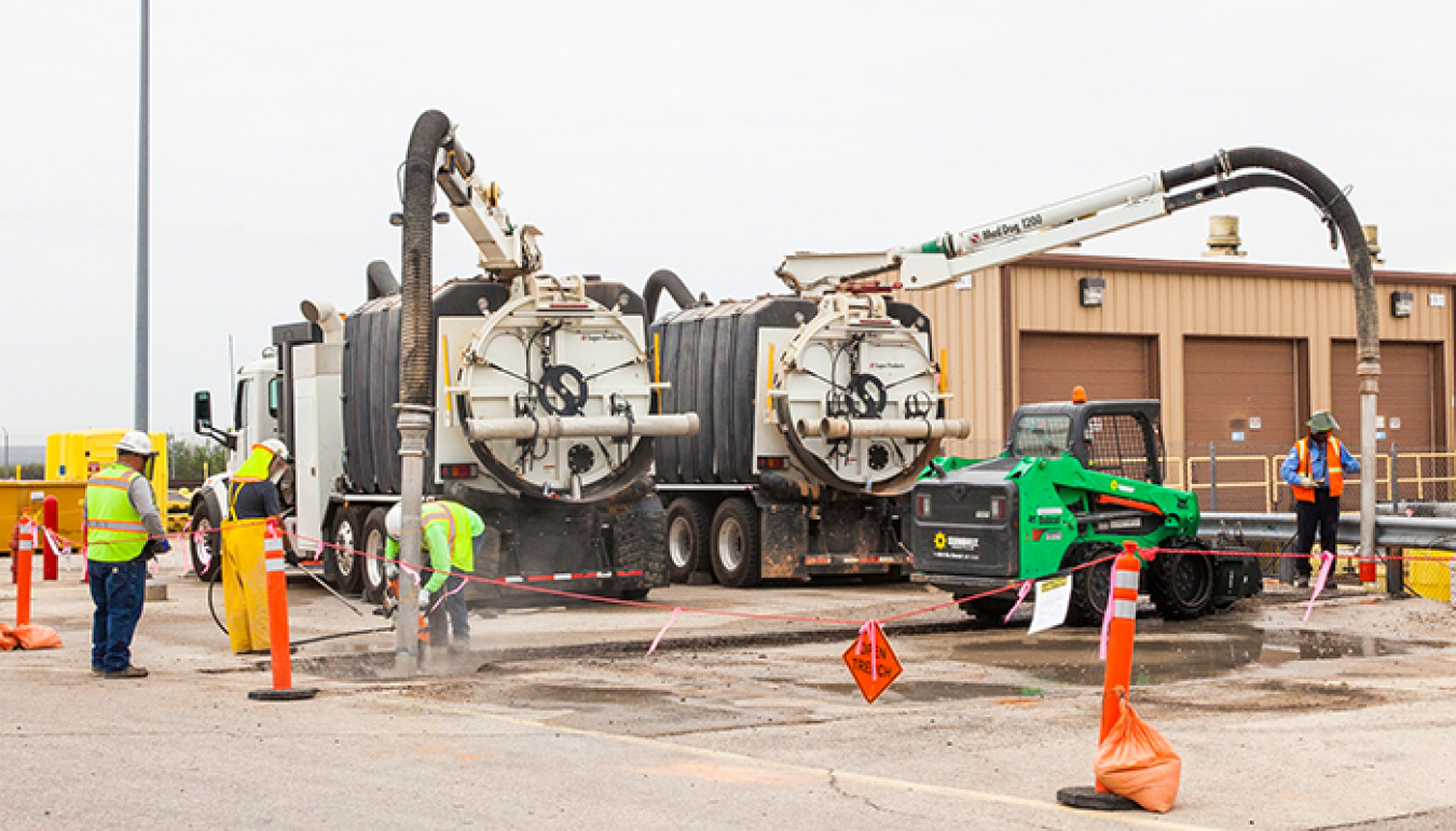 Workers dig a trench for a new fire suppression loop at the Waste Isolation Pilot Plant.