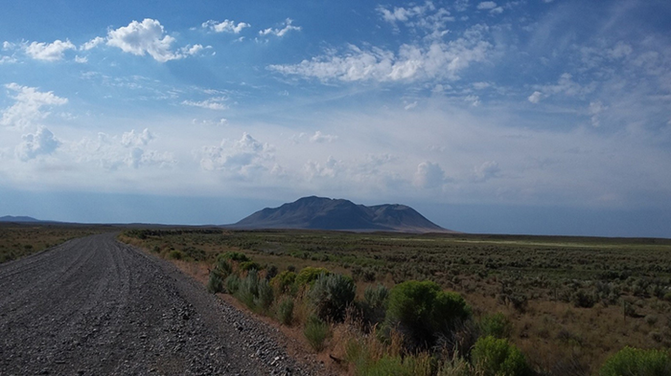 A tour for DOE representatives and others at the Idaho National Laboratory Site stopped to view Big Southern Butte, which holds spiritual significance for the Shoshone-Bannock Tribes.