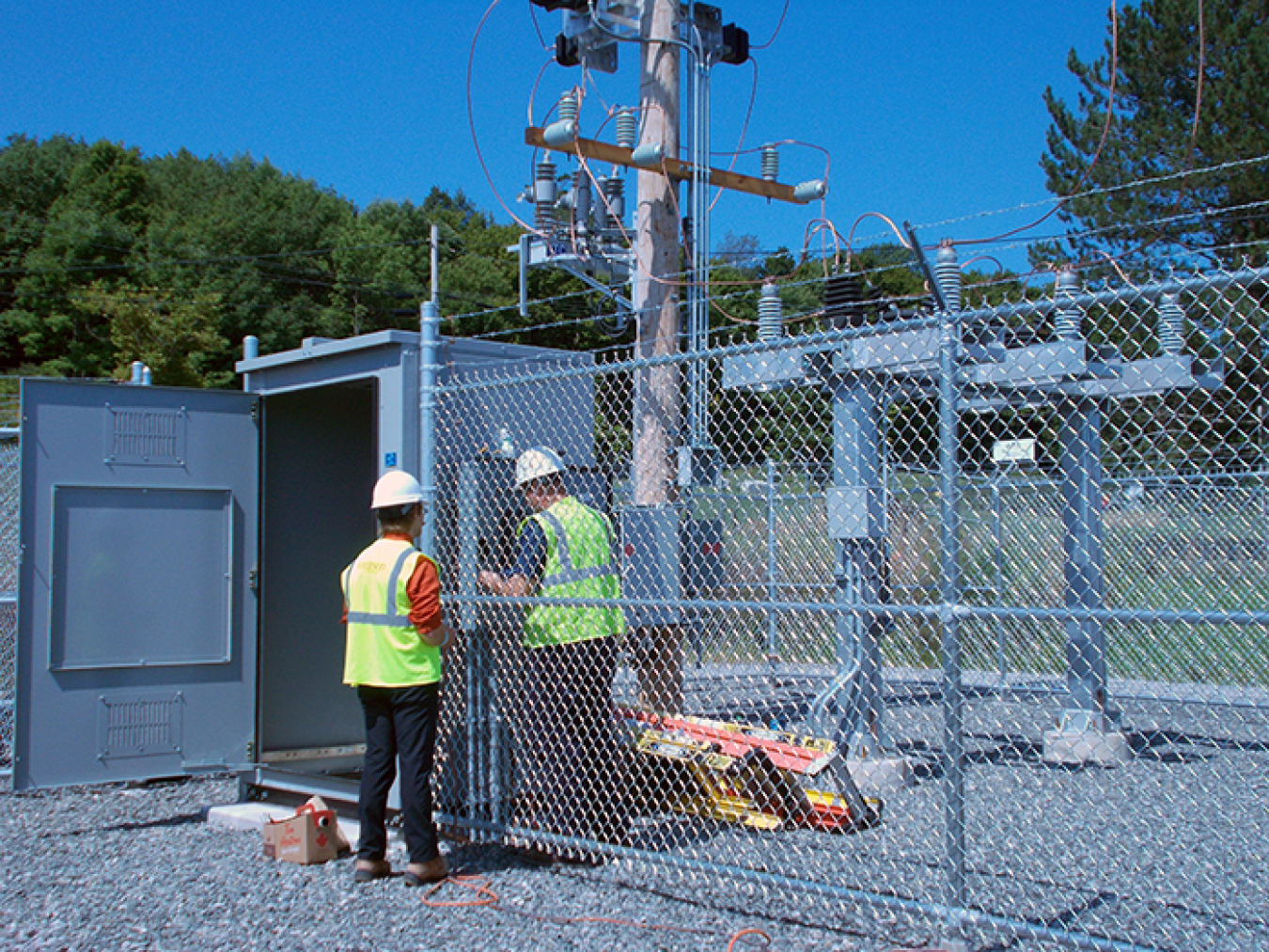 Workers perform tests at the West Valley Demonstration Project’s new switchgear station.