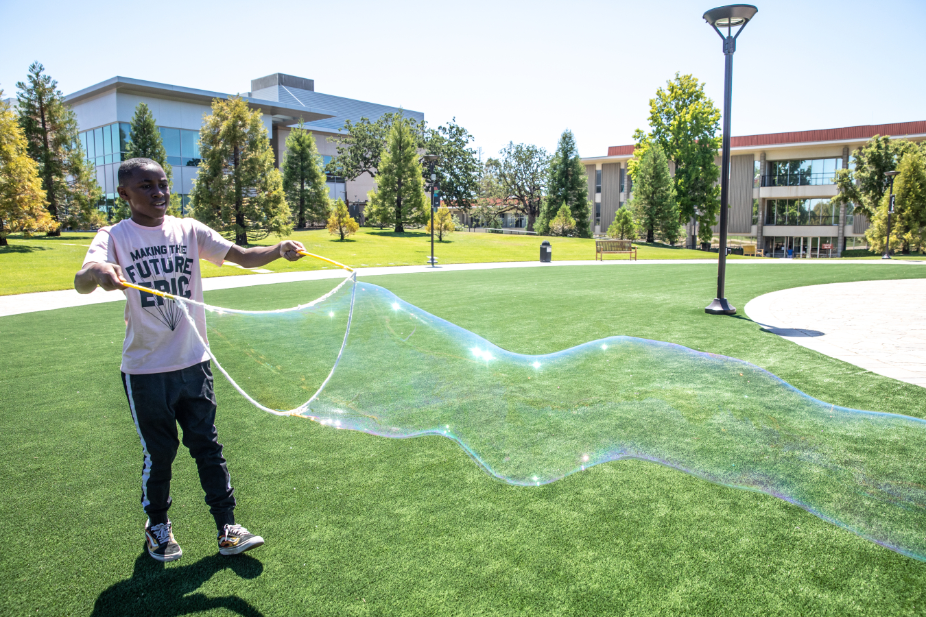 Proving that science can be fun, middle school students at the lab's CORE Science Institute made giant soap bubbles to learn about thin film interference, which happens when light reflects off the two thin layers of soap film that form a bubble.