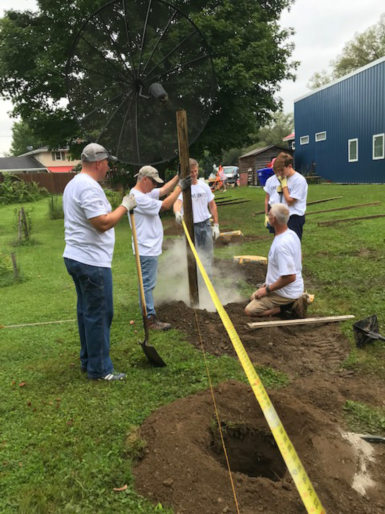 West Valley Demonstration Project employees construct a fence at the Springville Youth, Inc. facility.