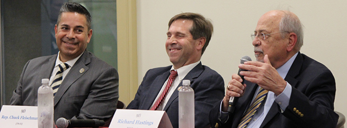 From left, Rep. Ben Ray Luján of New Mexico, Rep. Chuck Fleischmann of Tennessee, and former congressman Doc Hastings of Washington state discuss EM's progress over the past 30 years.