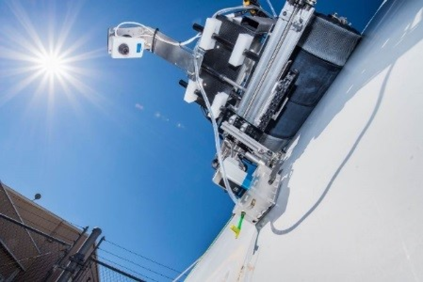 robot-deployed autonomous inspection system against the sun and a blue sky.