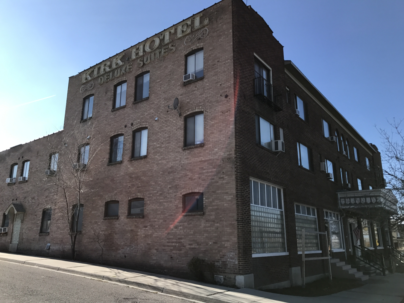 Exterior of a large brick building on a city block.