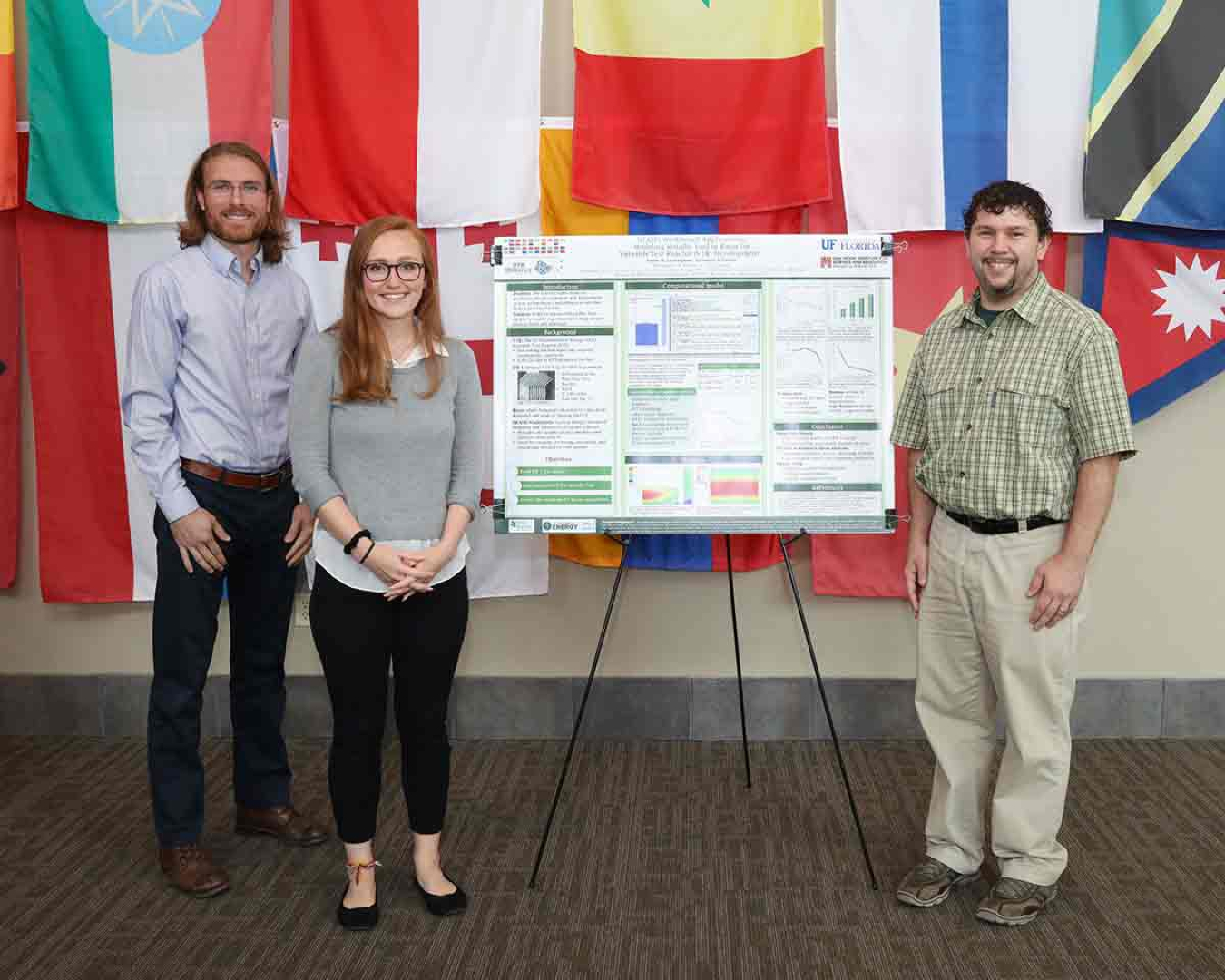 Kaylee Cunningham, center, earned Best Poster honors at the summer 2019 NESLS poster session. Here she is joined by her mentors, Robert Lefebvre, left, and Jeffrey Powers.