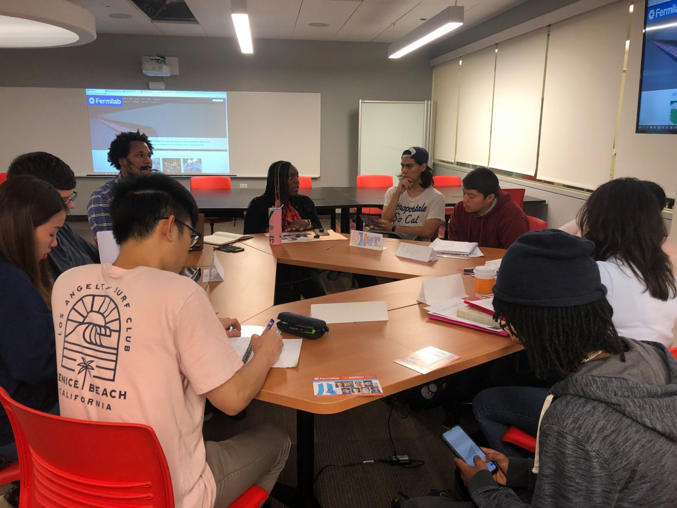 Harold Washington College students discuss the Community College Internship with Fermilab representatives.