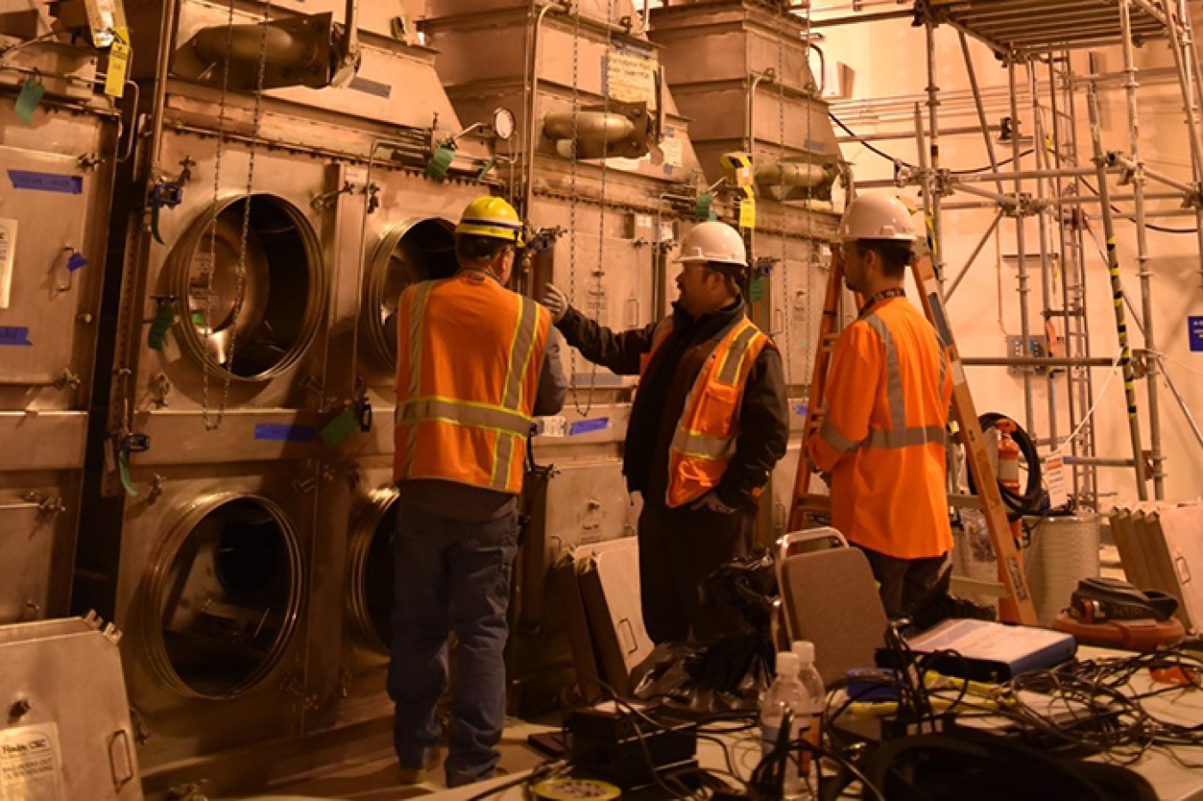 From left, Robert Sprague with Waste Treatment Completion Company, and Zach Phillips and Bill Trainor from Mississippi State University (MSU) test high-efficiency particulate air filters at Hanford’s Waste Treatment and Immobilization Plant.