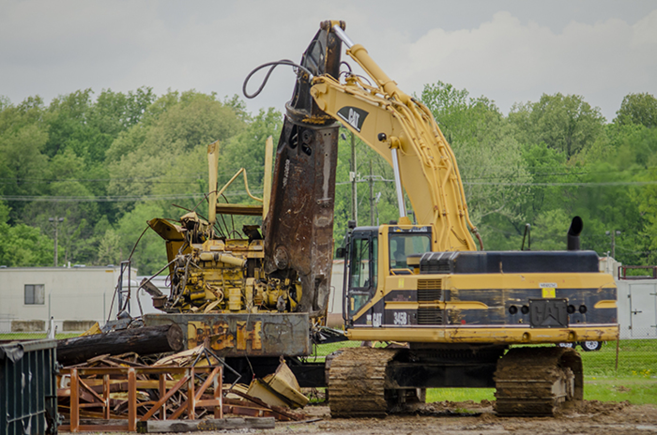 Four Rivers Nuclear Partnership Heavy Equipment Operator Brad Langston downsizes a decommissioned crane at the C-740 Material Yard.