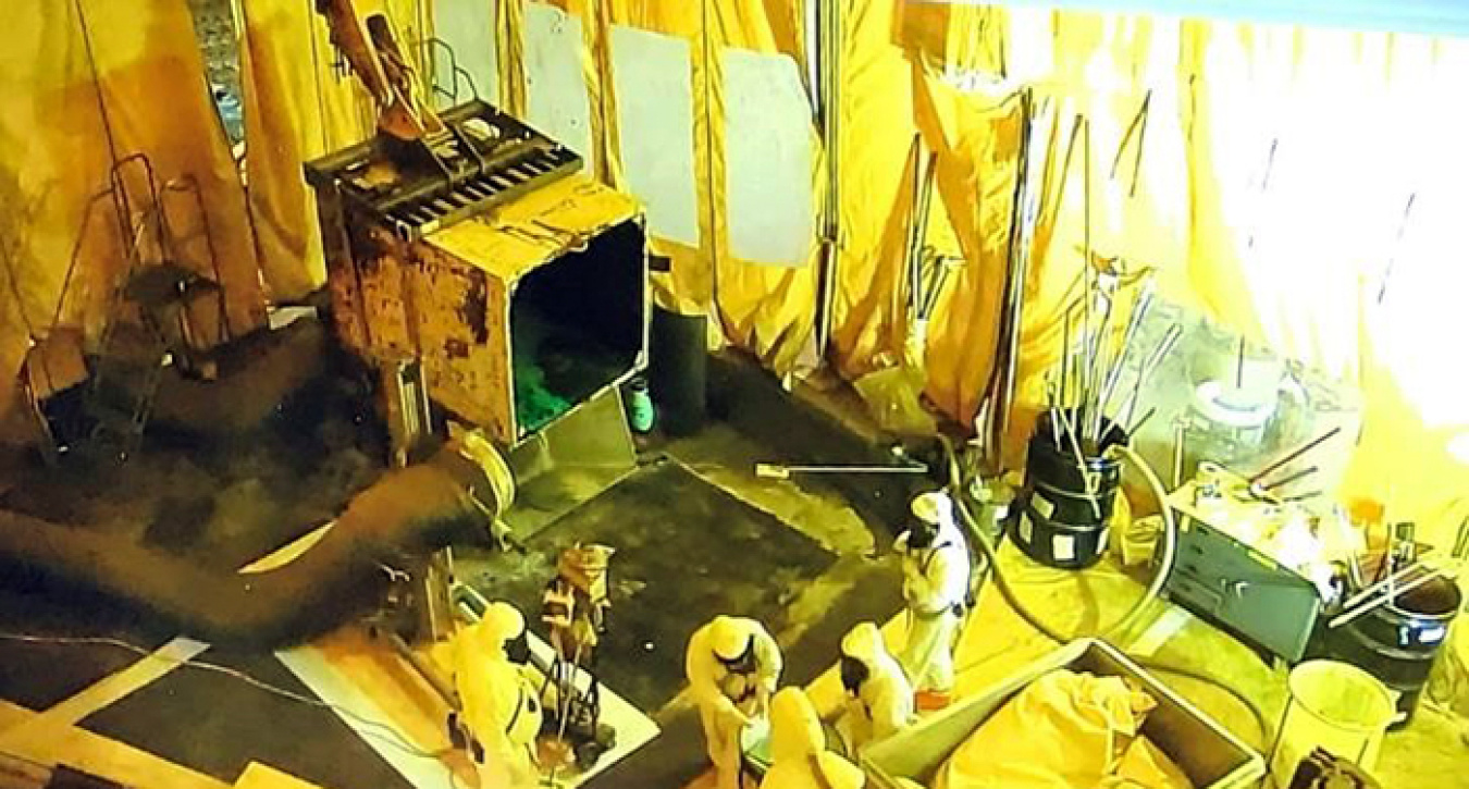 Inner contamination enclosures were in essence soft-sided buildings within a building that allowed crews to open, resize, segregate, and repackage challenging waste forms or containers.