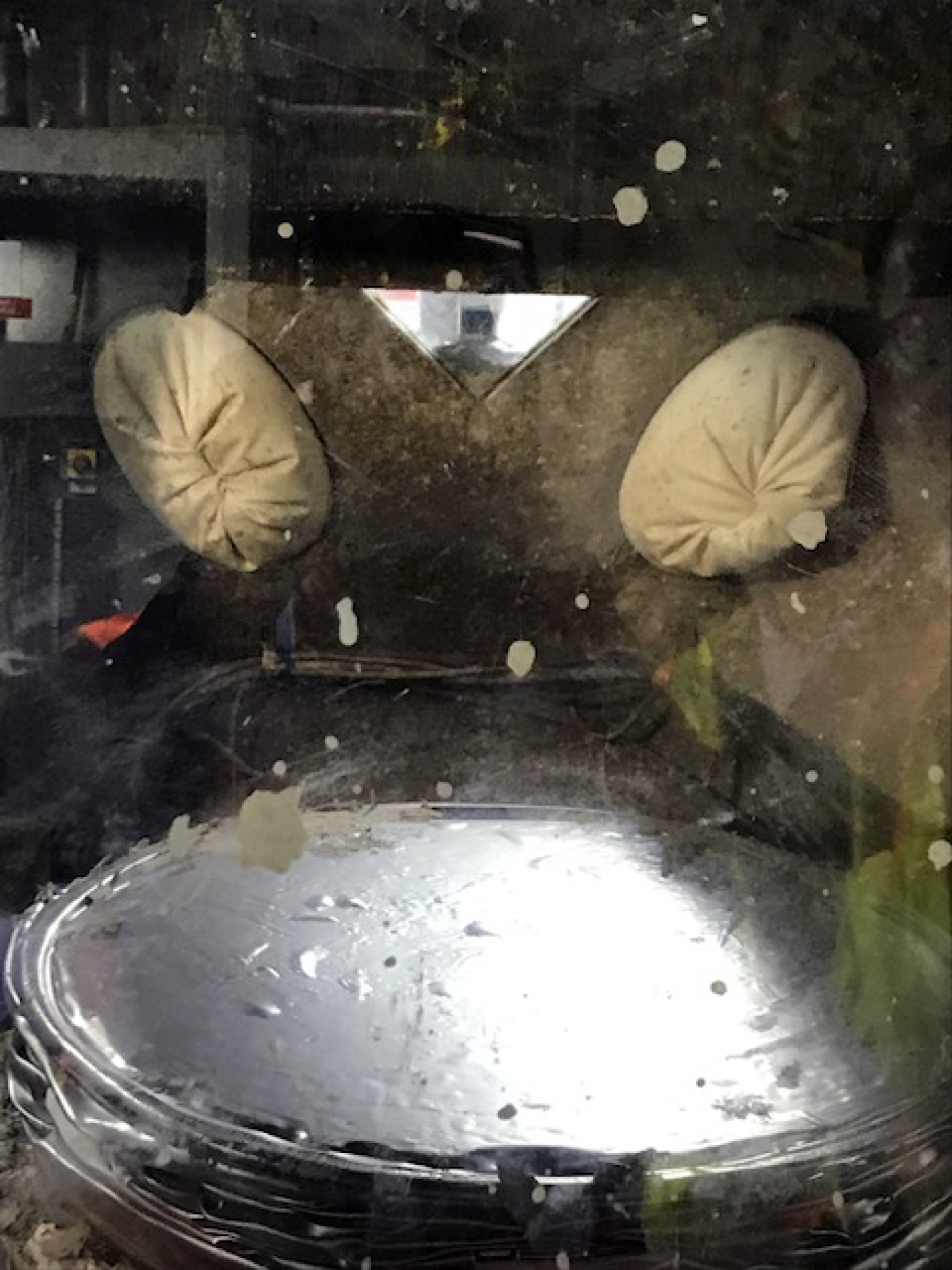 A silver 55-gallon was crushed into a “puck” by the supercompactor.