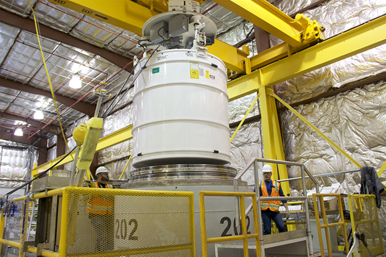 Advanced Mixed Waste Treatment Project crews prepare a transportation cask containing waste for shipment to EM's Waste Isolation Pilot Plant.