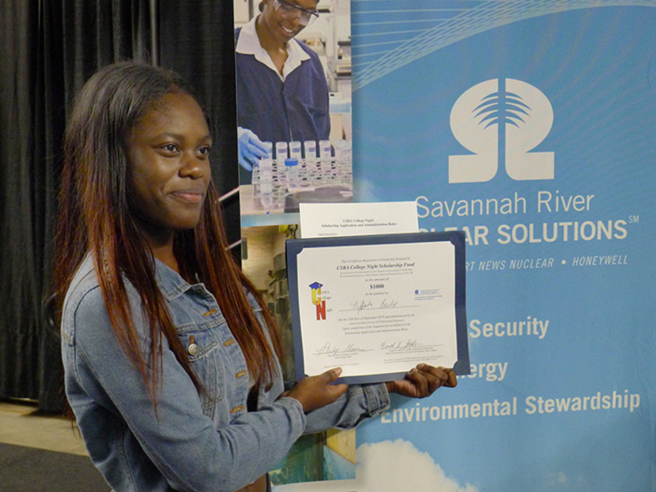 Local high school student Ny’Jada Braddy displays the $1,000 scholarship certificate presented to her at this year’s CSRA (Central Savannah River Area) College Night, where scholarships totaling $16,000 were awarded.