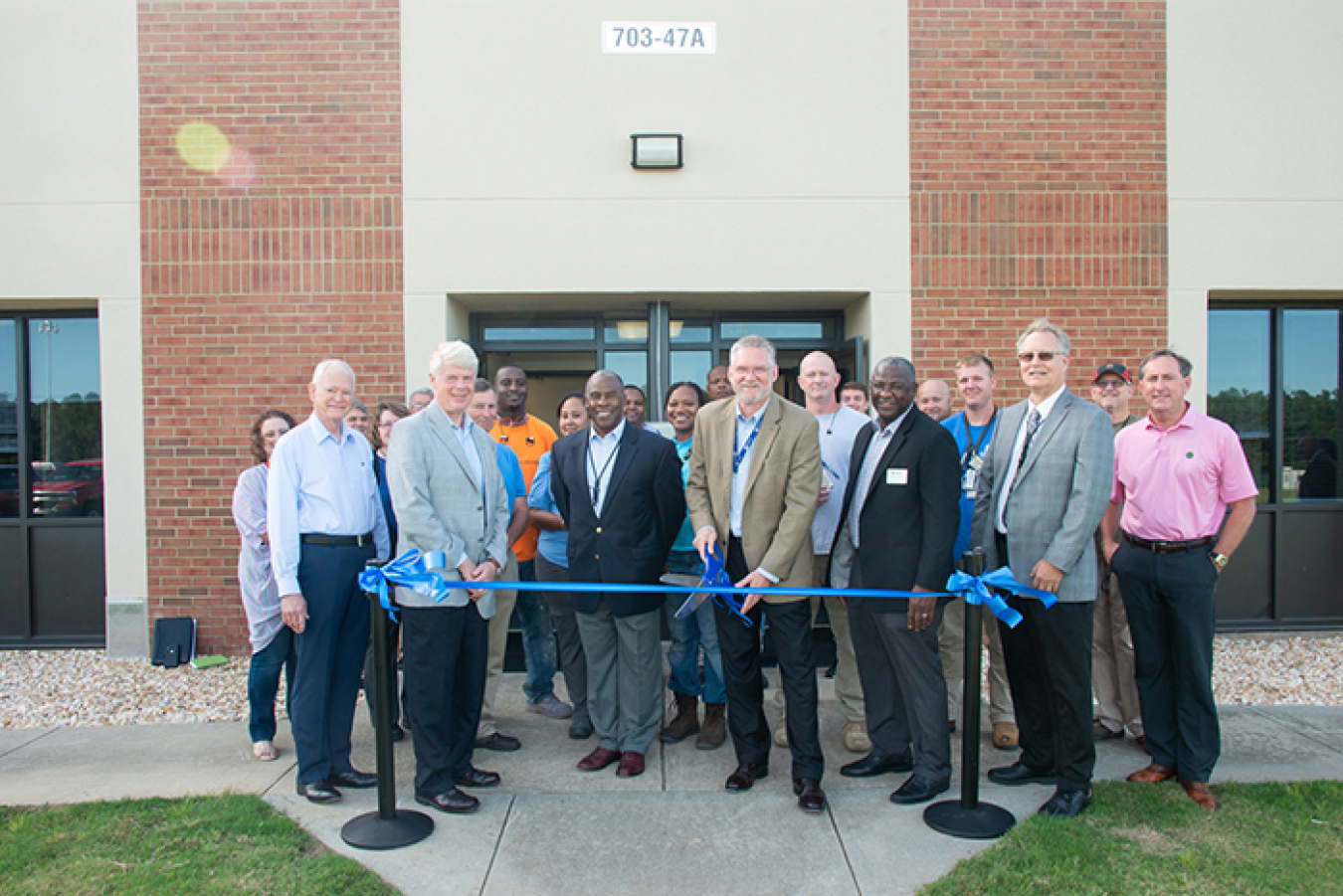 Savannah River Site federal and contractor employees gather for a ribbon cutting for a “one-stop shop” for employee onboarding at Savannah River Nuclear Solutions (SRNS).