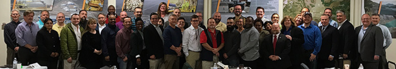 Federal and contractor employees from across the EM complex gather for a photo during the EM IT Collaboration Meeting. DOE Chief Information Officer Rocky Campione is third from right and EM Communications Director Jeanne Beard is ninth from right.