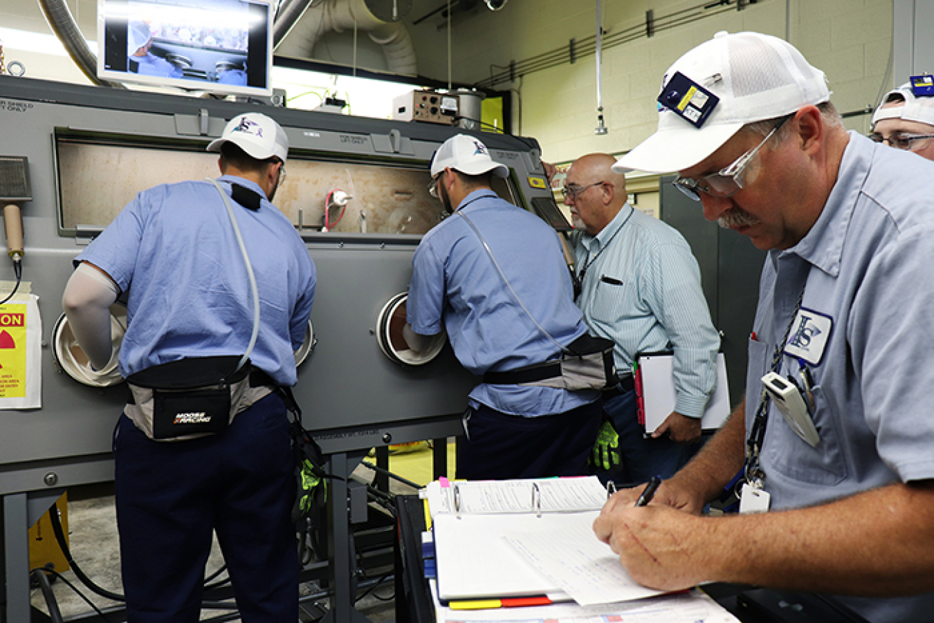 Workers at Oak Ridge install new gloveboxes to begin processing a portion of uranium-233 a year ahead of schedule.