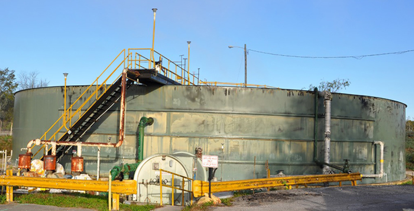 The K-1203 complex, pictured at top before demolition, was located in the Poplar Creek area of Oak Ridge’s East Tennessee Technology Park. Immediately above, the K-1203 site’s transformation is complete after workers placed more than 11,000 cubic yards of