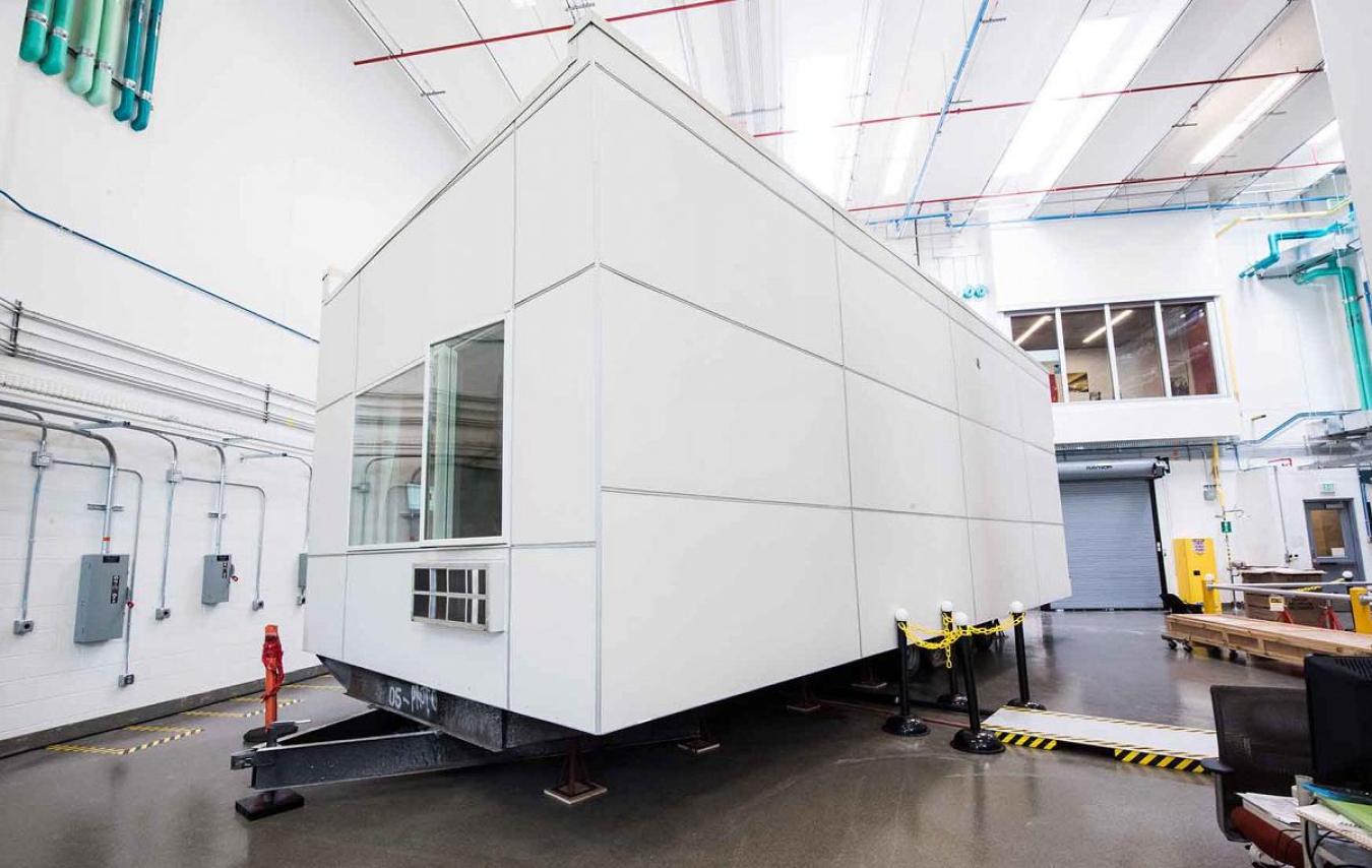 NREL's iUnit is a modular apartment that can be moved indoor for guarded testing or outdoor for environmental testing. NREL is using iUnit to conduct validation-grade energy simulation experiments.
