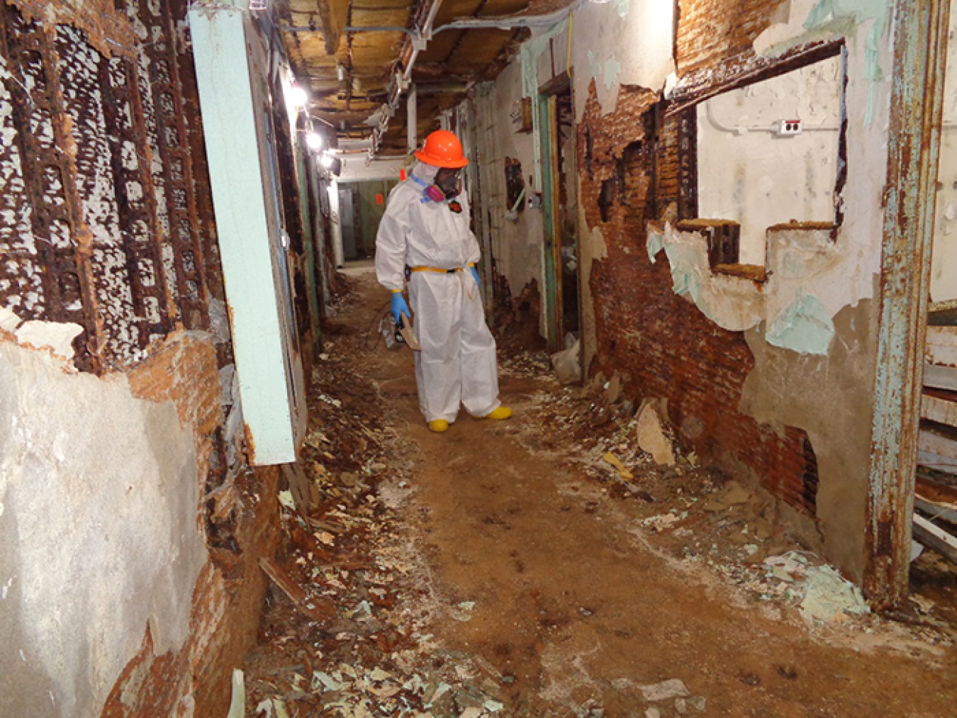 Photos show a hallway in the Biology Complex before, at top, and after Oak Ridge crews completed asbestos abatement.