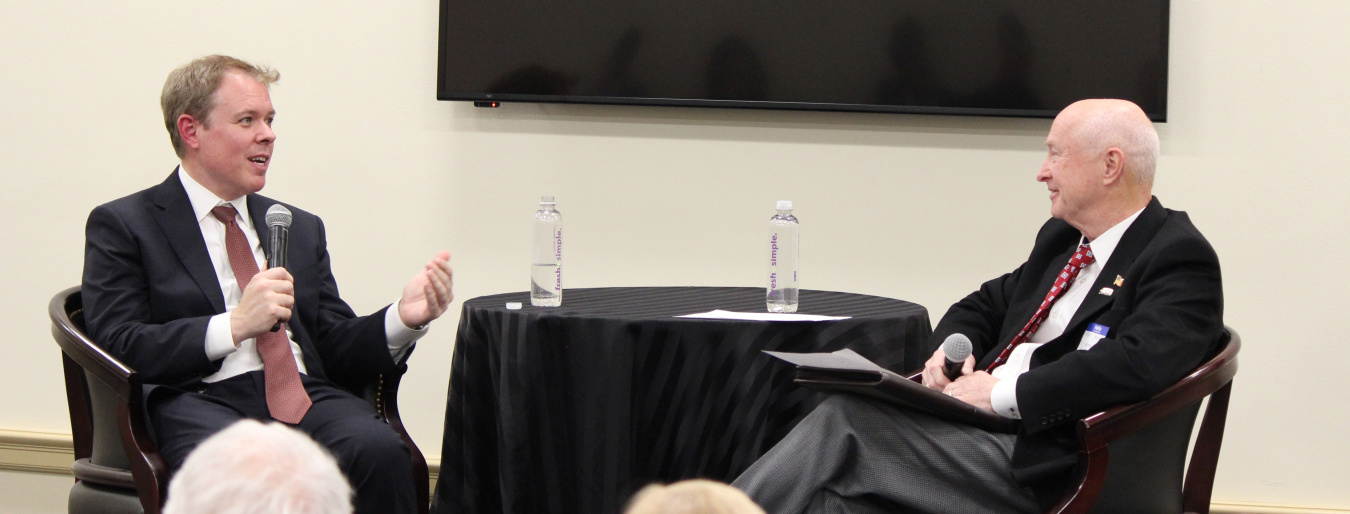 Ike White, left, head of the EM program, discusses EM’s cleanup progress with Pat Hopper, president of the Energy Technology and Environmental Business Association. Hopper moderated the event for the House Nuclear Cleanup Caucus.