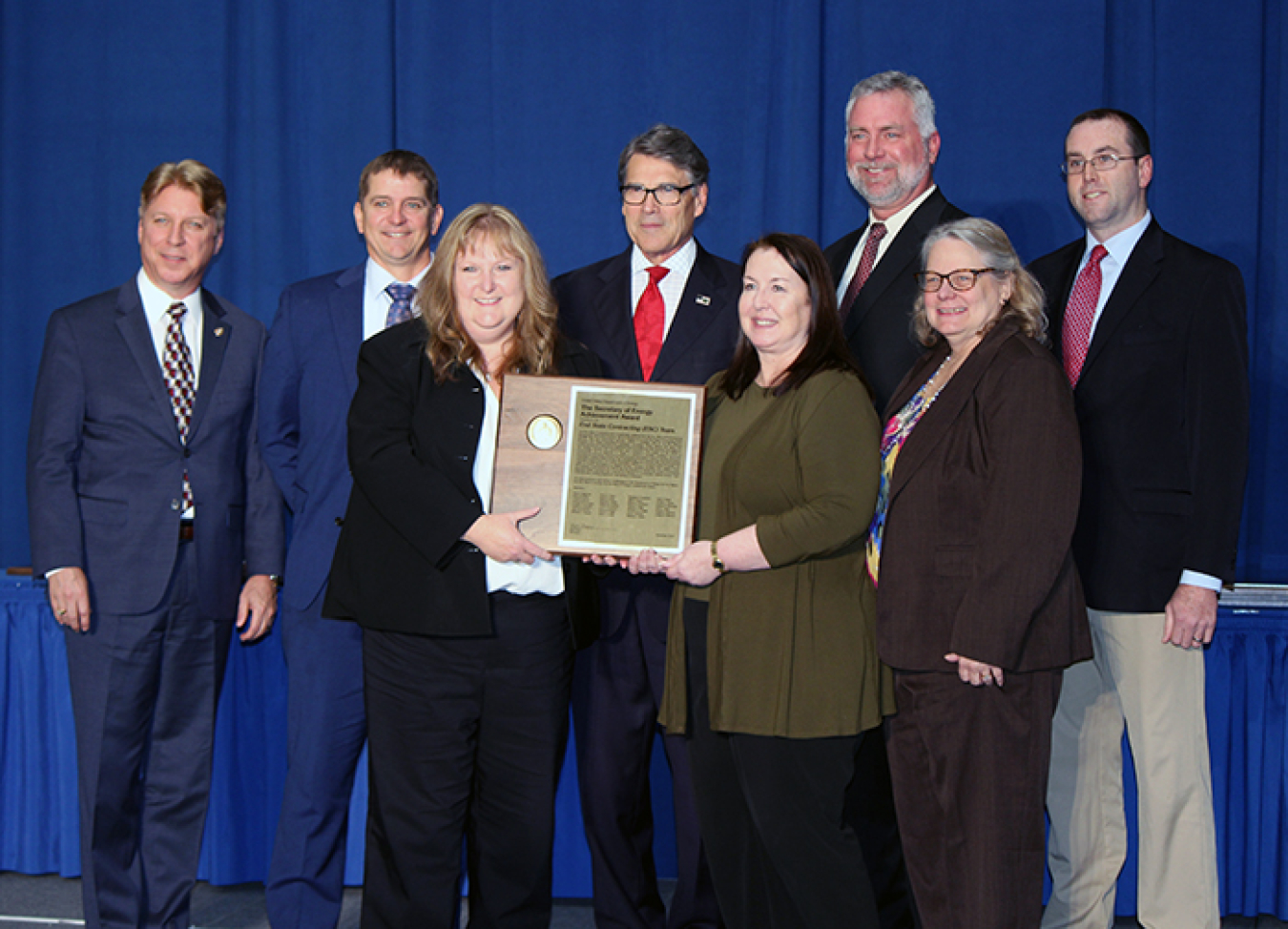 Some of the members of the End State Contracting Team accept the Secretary of Energy Achievement Award from Secretary Rick Perry on behalf of the 27-member team.