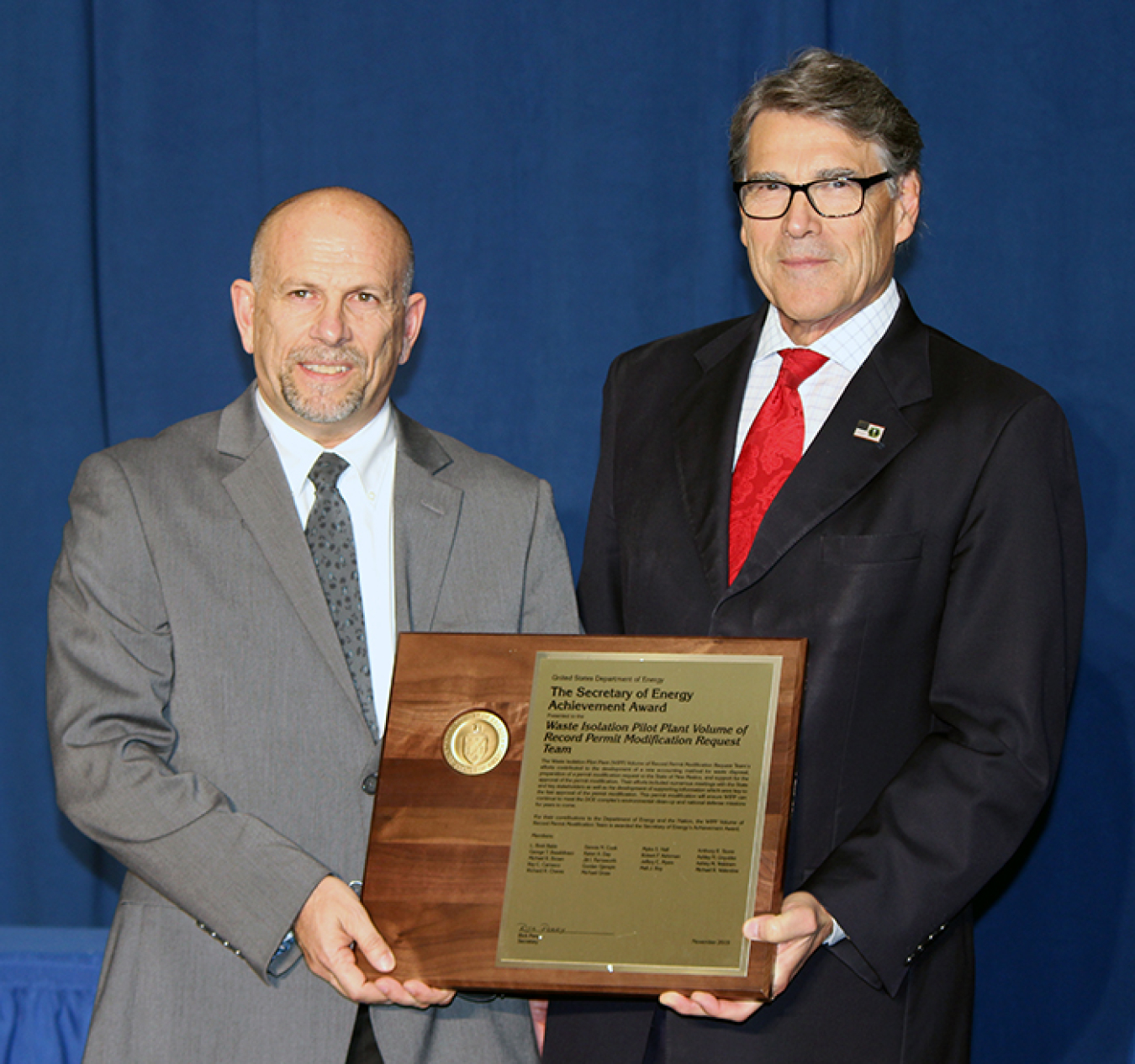 Energy Secretary Rick Perry, right, presents the Secretary of Energy Achievement Award to Anthony Stone, senior quality assurance specialist and former Resource Conservation and Recovery Act manager for EM’s Carlsbad Field Office.