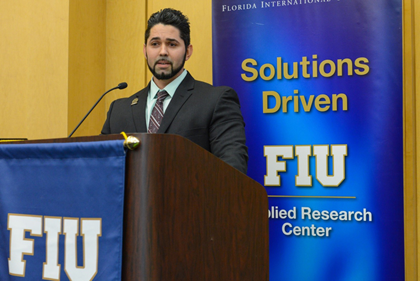 Roger Boza of the DOE Fellows Class of 2018 speaks during the DOE Fellows Class of 2019 induction ceremony.