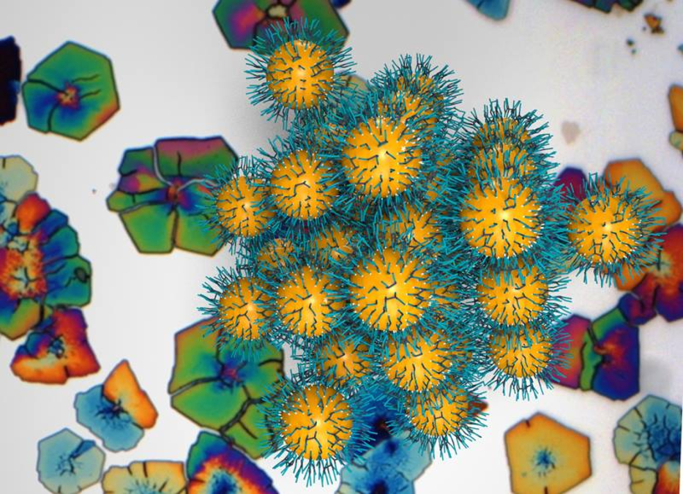 Forward image created by coarse-grained molecular dynamics simulation. It depicts a superlattice of nanoparticles (yellow) stabilized by ligands (blue). Background image of the superlattice taken by optical microscopy.