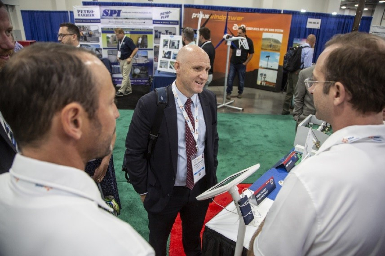 Daniel Simmons speaks to a member of the Phase 3 Photovoltaics Solar Prize winning team.