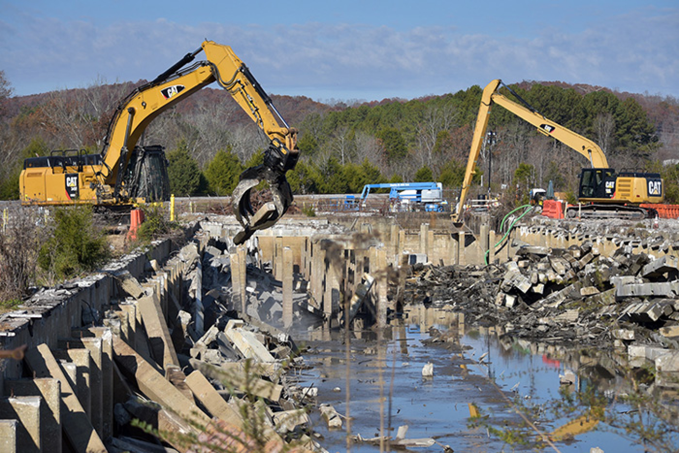 Crews remove concrete subsurface structures of the K-832 basin. UCOR pumped nearly 2 million gallons of water from the basin before beginning demolition.
