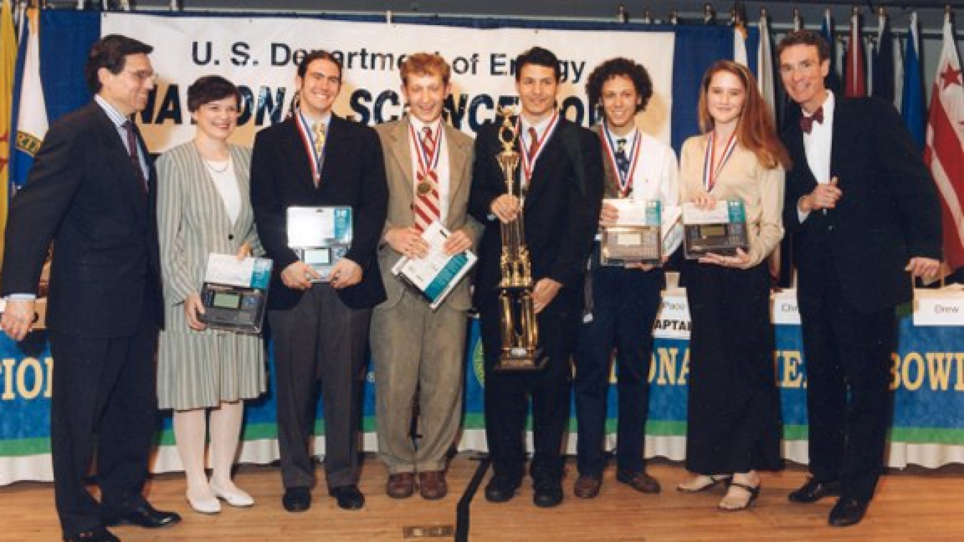 Paco Jain (fourth from the right holding the trophy) on the winning team of the 1998 National Science Bowl.