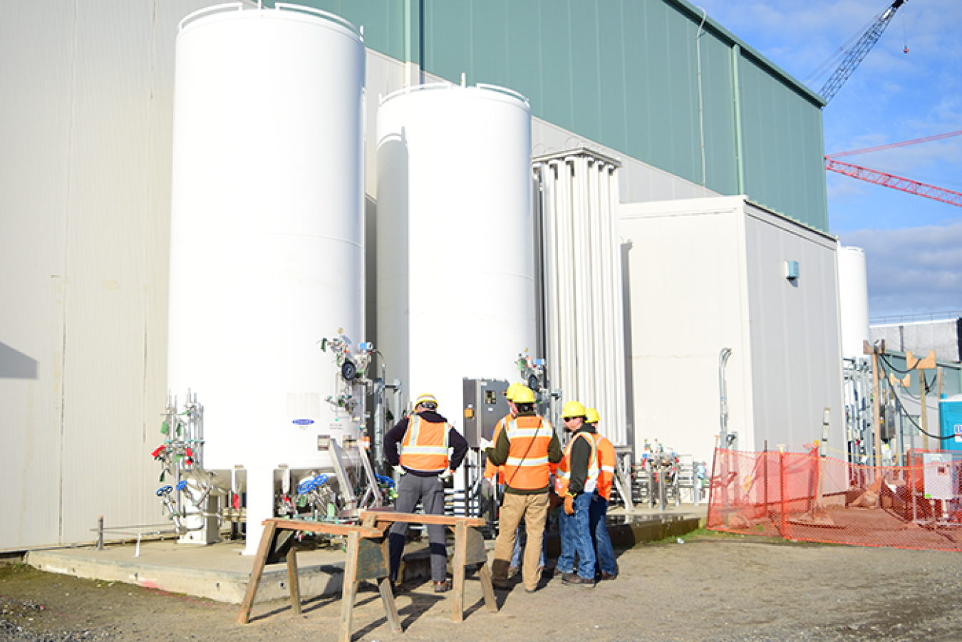 Hanford Waste Treatment and Immobilization Plant (WTP) workers inspect two bulk liquid argon storage tanks that are part of the liquid gas storage system at the WTP Analytical Laboratory.