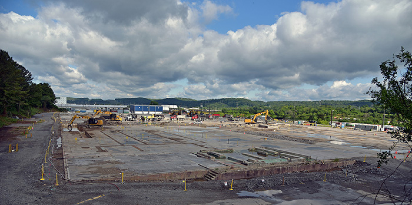 Before and after: Demolition of the 380,000-square-foot K-1037 Building left behind a massive slab, at top, which workers have since removed, above.