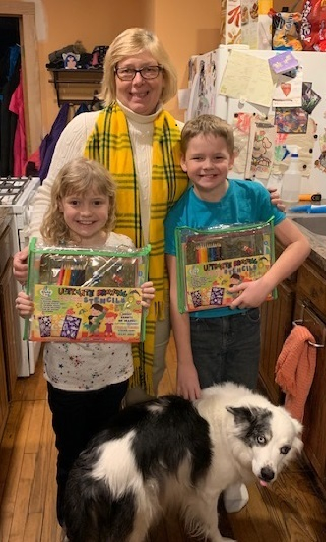 Ellie and Kael Tuttle receive artist kits from CH2M HILL BWXT West Valley Facilities Manager Lettie Chilson as a reward for creating drawings for the EM West Valley Demonstration Project’s Family Fun Safety Calendar.