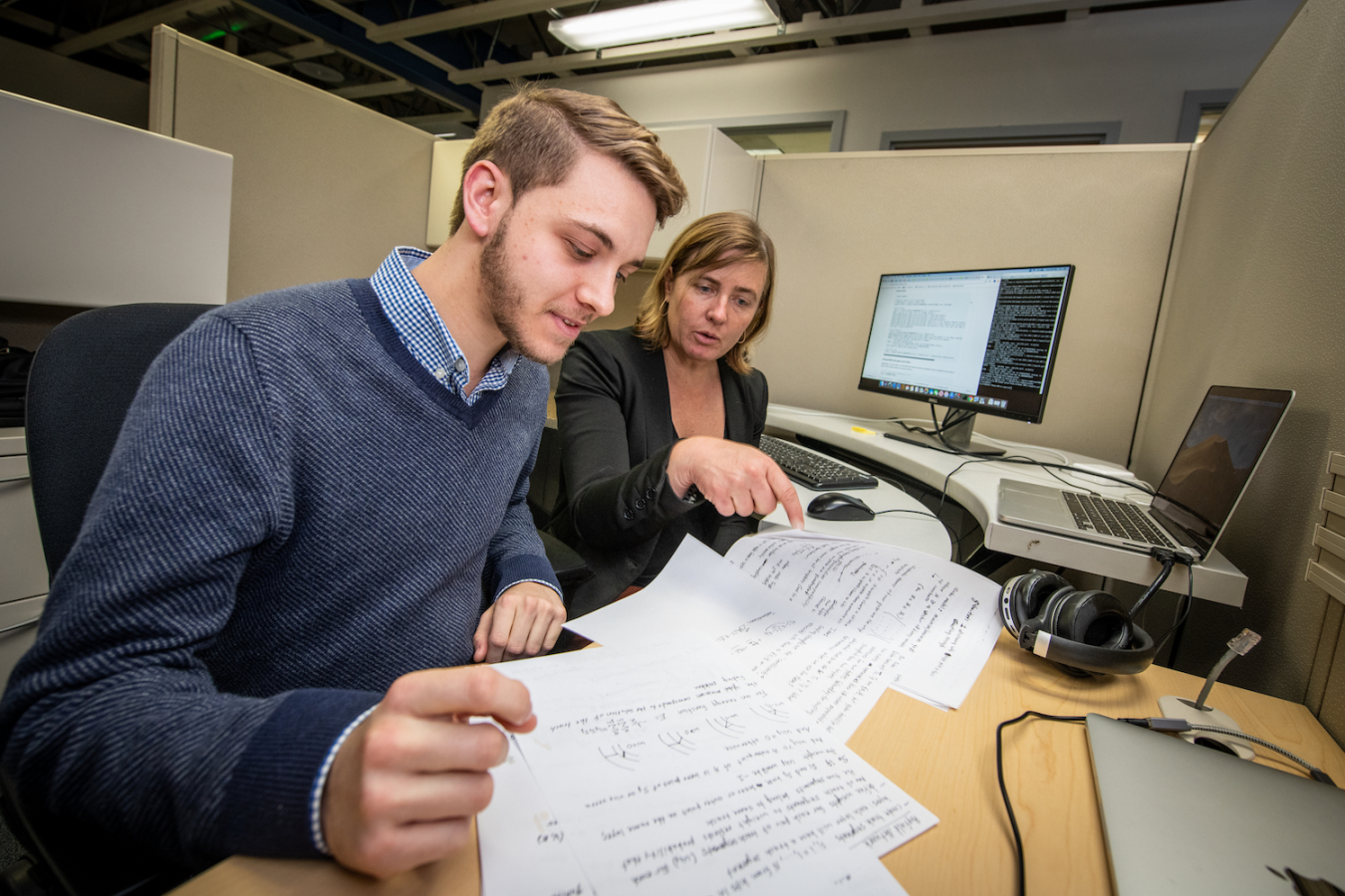 Science Undergraduate Laboratory Internship program participant Eric Rohm, left, and mentor Heather Gray