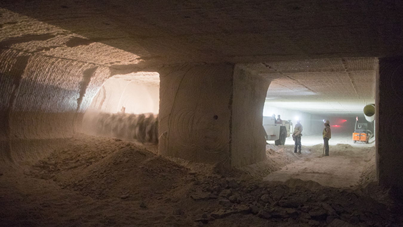 EM crews prepare the next area where transuranic waste will be emplaced at EM's Waste Isolation Pilot Plant. A continuous miner, at left, cuts through salt 2,150 feet beneath the surface.