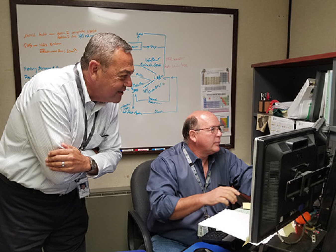 David Bowling, left, owner of Linear Path, and Phil Clark work on data automation as part of their services to UCOR, Oak Ridge’s cleanup contractor.