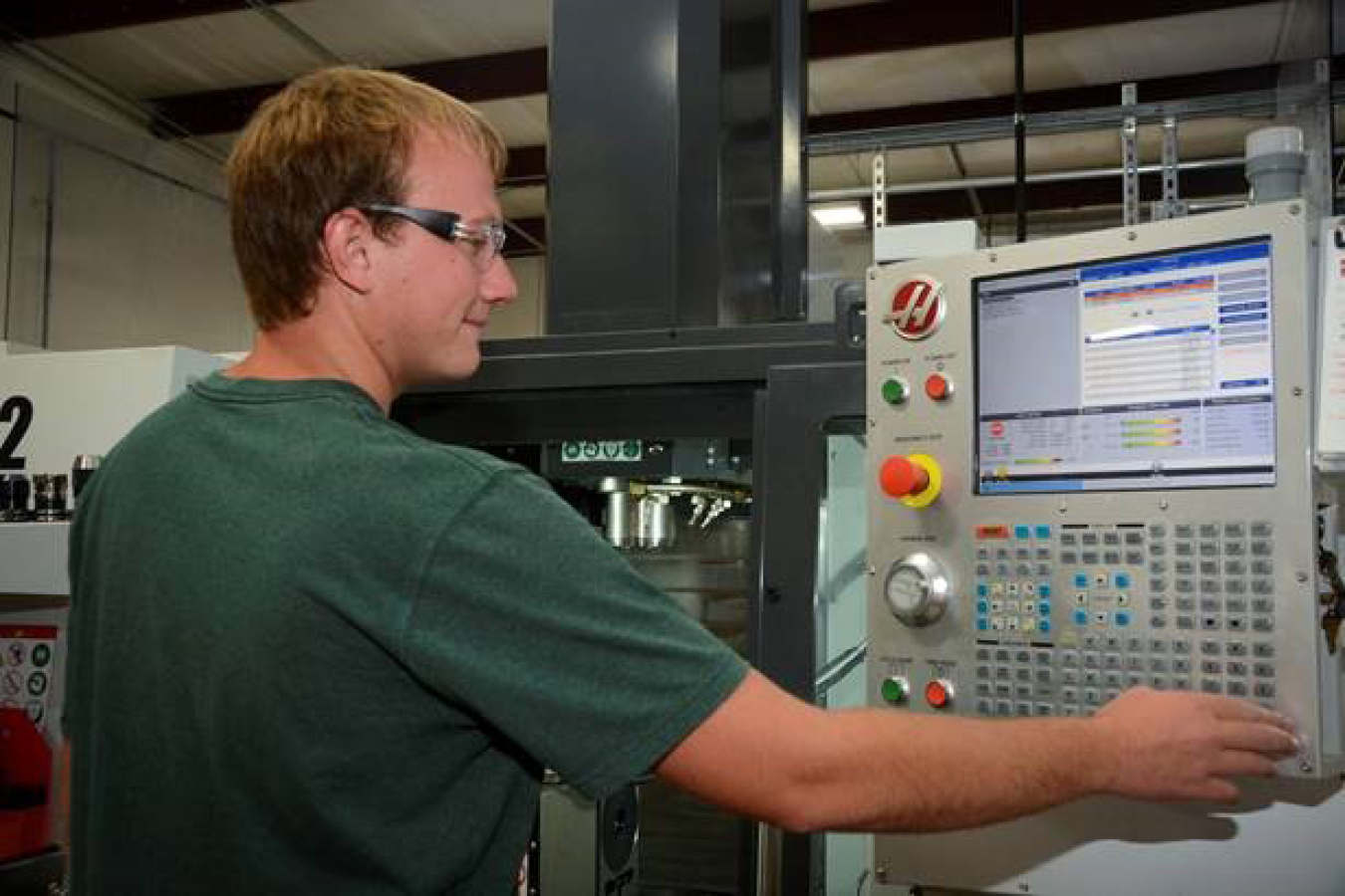 An employee with InSolves, a small, locally-owned business providing technical services and specialty manufactured products to Fluor-BWXT at EM’s Portsmouth Site, operates a computer-controlled lathe in Piketon, Ohio.