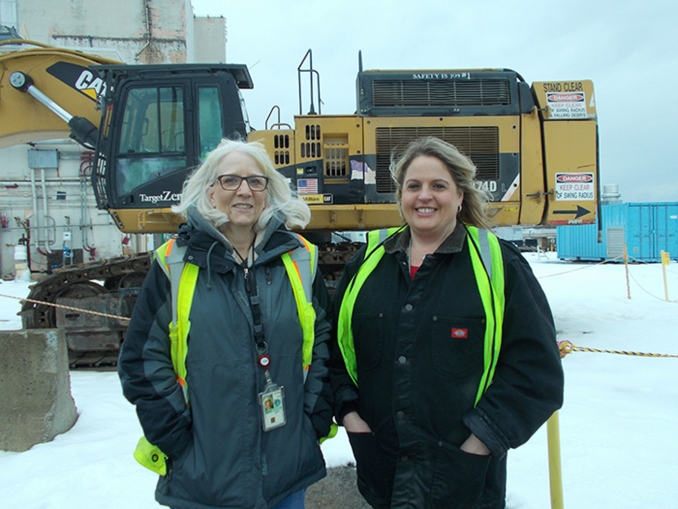 Pam Walters, left, CH2M HILL BWXT West Valley (CHBWV) operations manager, and Cheryl Wozniak, CHBWV safety engineer, stand near a structure scheduled for demolition at EM’s West Valley Demonstration Project.