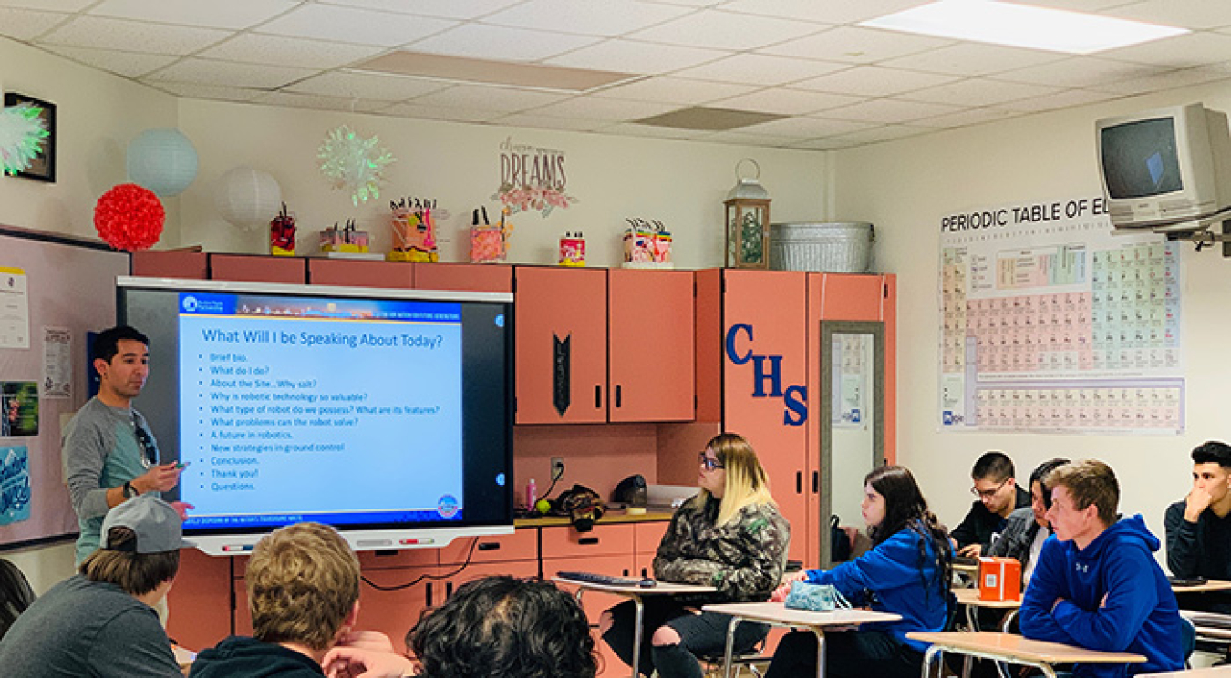 Chris Dominguez, a geotechnical engineer with Nuclear Waste Partnership, talks with students from Carlsbad High School about engineering careers at EM’s Waste Isolation Pilot Plant.