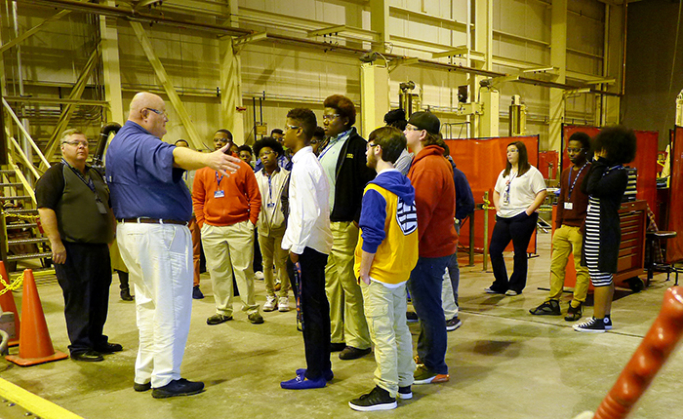 Chip Jenison, Savannah River Nuclear Solutions mechanical shops manager, describes the day-to-day work of a maintenance mechanic to students from the Richmond County School System during their tour of the Savannah River Site.