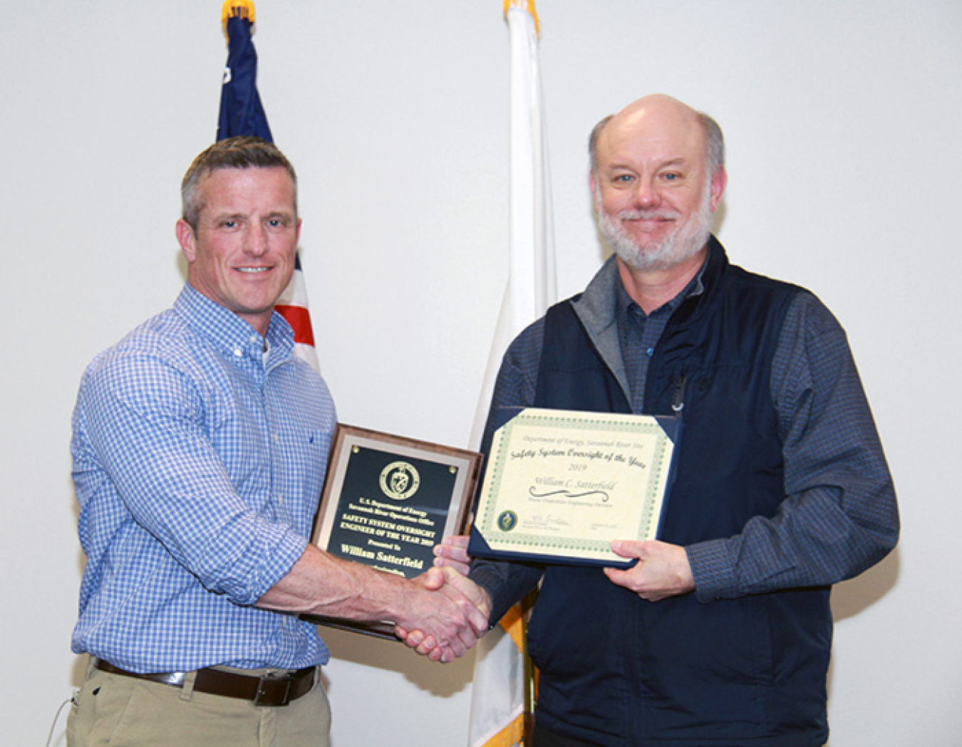 Mark Smith, director of the waste disposition engineering division at DOE-Savannah River (DOE-SR), presents the Safety System Oversight Engineer of the Year award to William Satterfield.