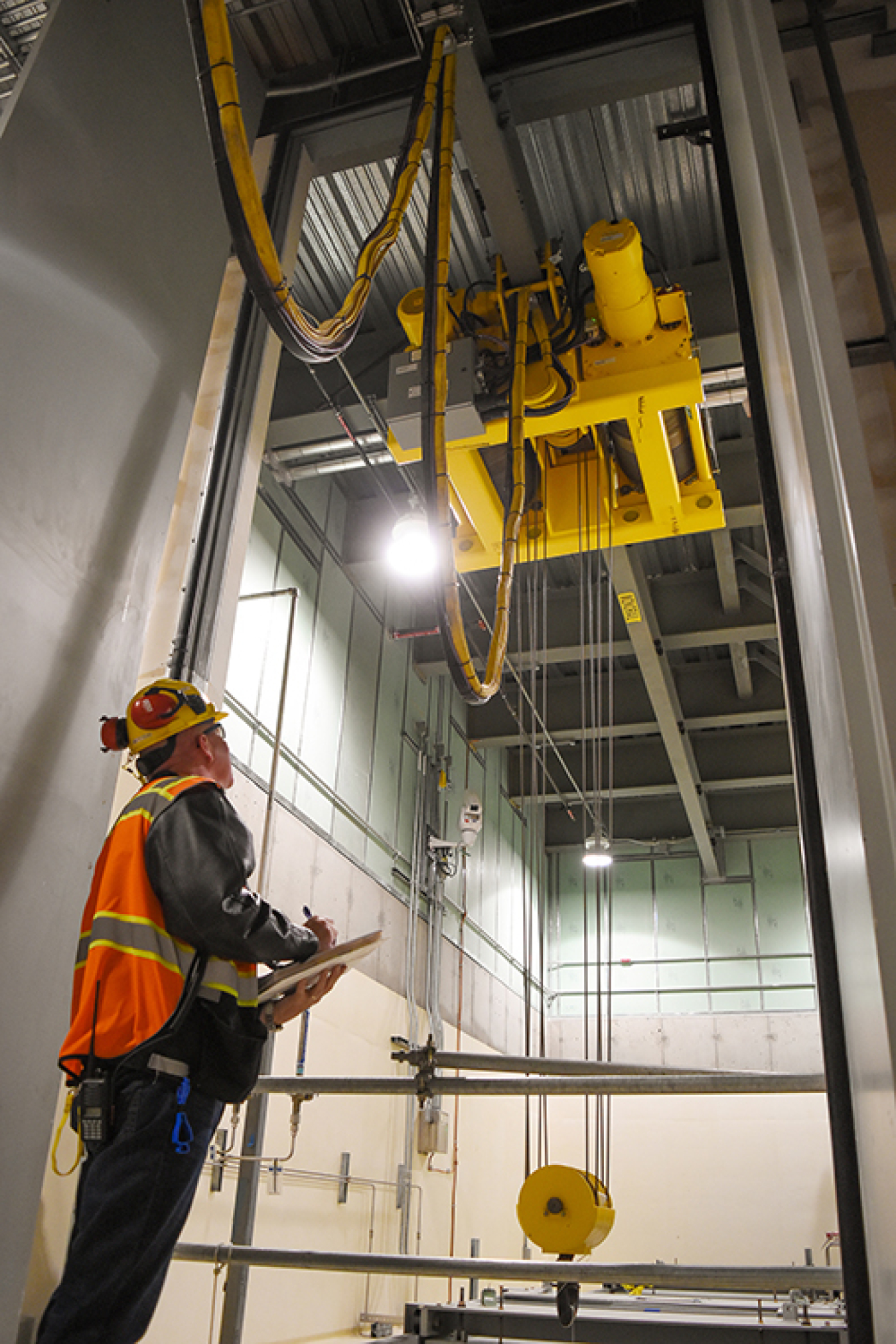 Julian Leam, senior mechanical handling test engineer with Waste Treatment Completion Company, observes as a transfer hoist is remotely operated from the Hanford Low-Activity Waste Facility control room.