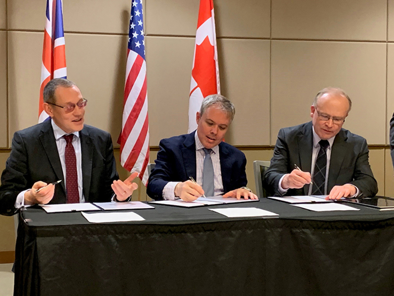 Ike White representing EM; and Alastair MacDonald of Atomic Energy of Canada Limited, took part in a signing ceremony at the Waste Management Symposia 2020 in Phoenix.