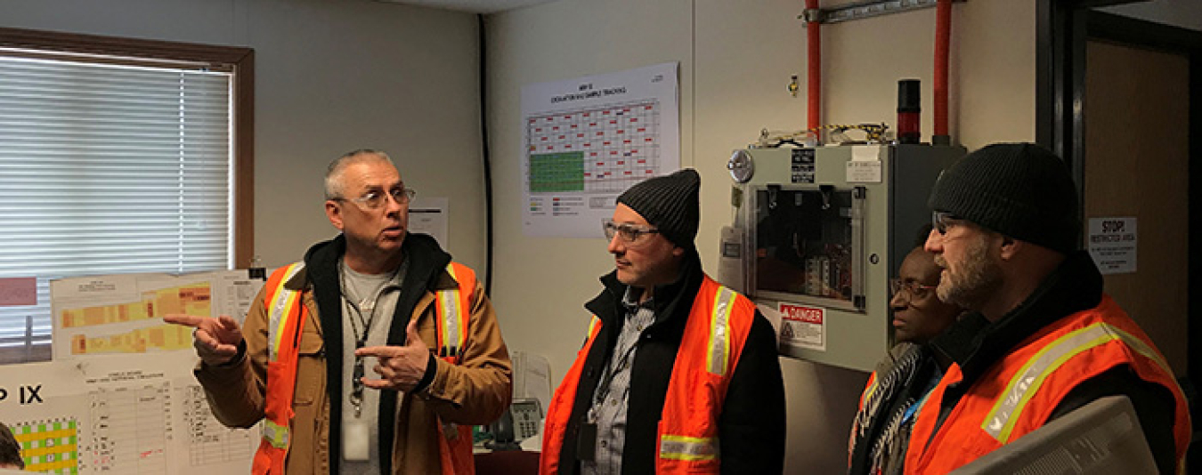 Jim Southwick, Fluor Idaho nuclear operations manager for the Accelerated Retrieval Project, discusses EM’s targeted buried waste exhumation mission at the Radioactive Waste Management Complex with Mahmoud Karam of Canadian Nuclear Laboratories.