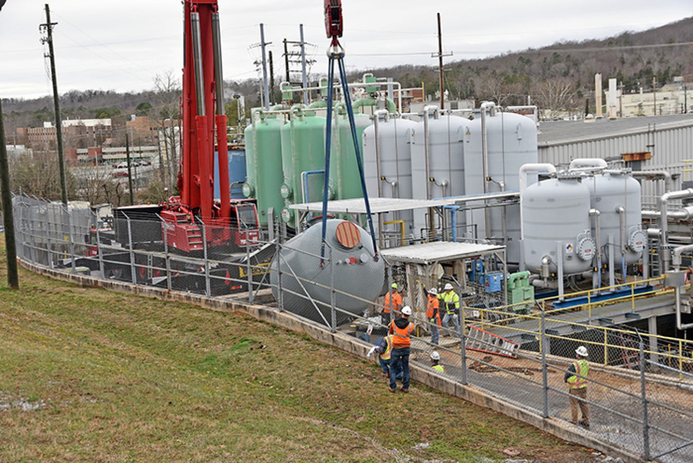 A crane lowers one of the five new vessels for a new modernized zeolite treatment system at Building 3608 in Oak Ridge National Laboratory’s central campus area. It replaces an aging system in Building 3544.