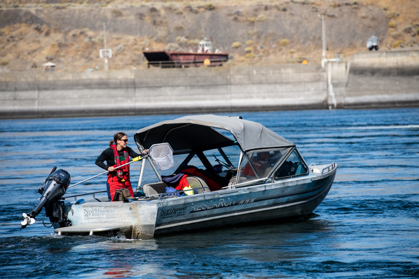 PNNL researchers retrieve the Sensor Fish after they’ve traveled through the dam.