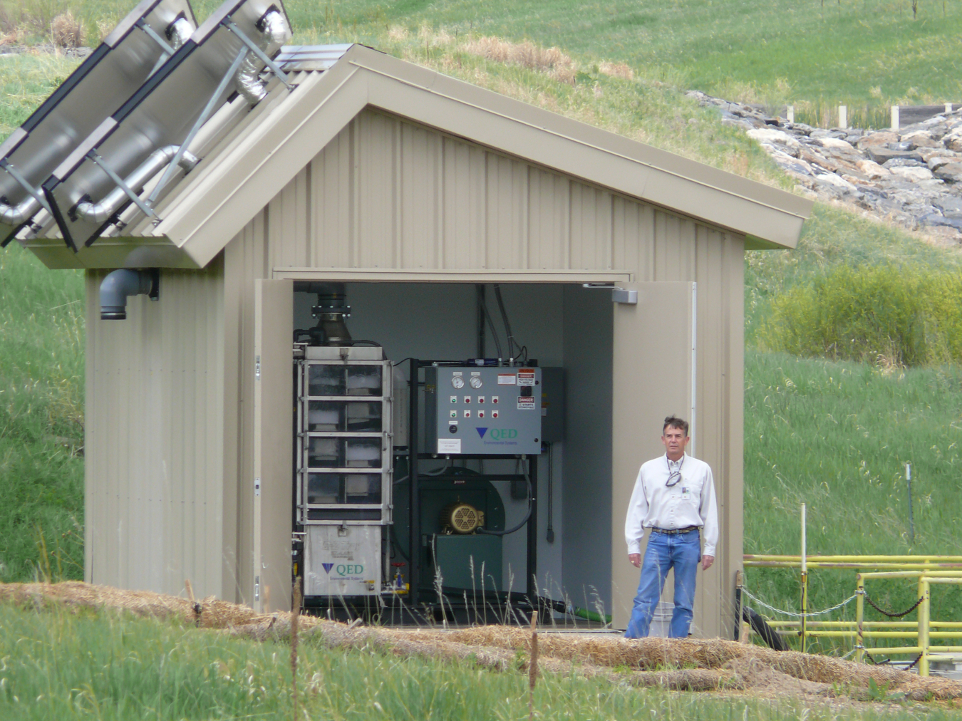 John Boylan working with the Rocky Flats Site solar-powered water treatment system.