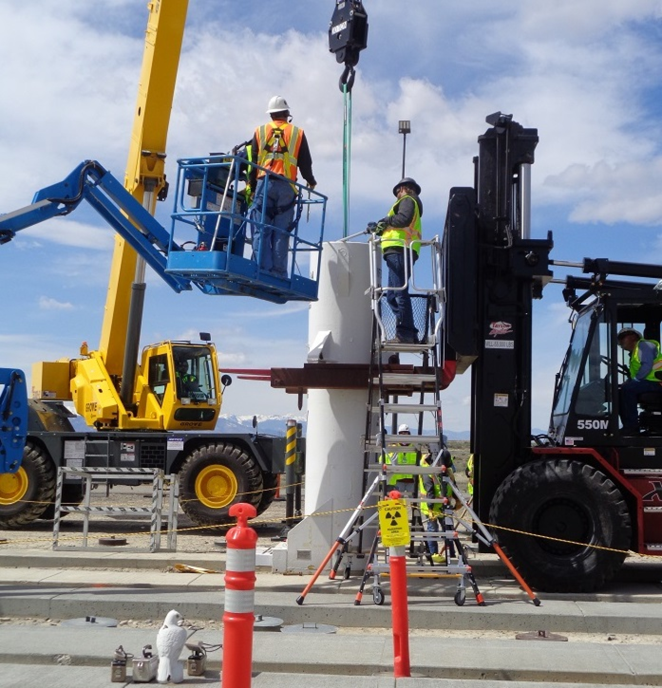 Idaho National Laboratory Site crews position a shipping cask