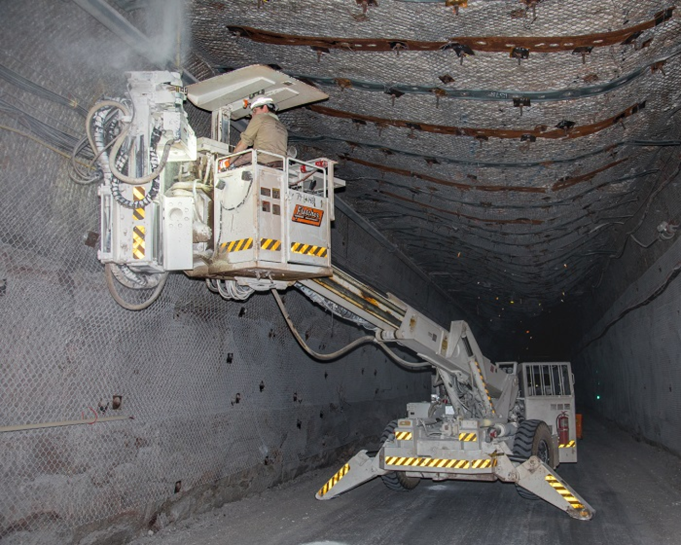 A miner at the Waste Isolation Pilot Plant (WIPP) installs a roof bolt 2,150 feet below the surface in the WIPP underground. WIPP is the nation's only repository for the permanent disposal of defense-generated transuranic waste.